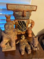 Group shot of four terracotta figures