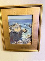 Front view of framed seascape painting
