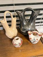 Group shot of all four pottery pieces