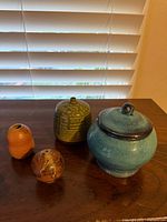 Four pottery pieces on tabletop