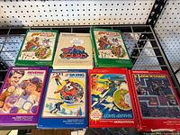 Six Intellivision game boxes on shelf