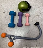 All accessories grouped: dumbbells, weighted ball, massage cane