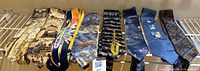 All eight novelty neckties laid out on shelf