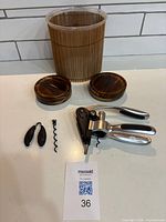 Full set showing ice bucket, four coasters, corkscrew opener, foil cutter, spare worm