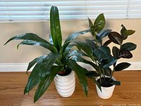 Both artificial plants side by side showing foliage and pots