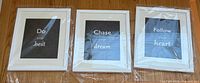 All three framed quote prints side by side in original wrap