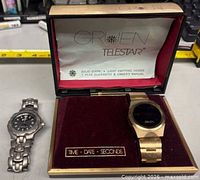 Overview showing Citizen watch, Gruen watch in box, display insert
