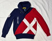Front of navy/red sweater with white X applique