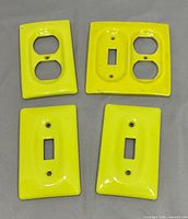 Group shot of all four yellow ceramic cover plates