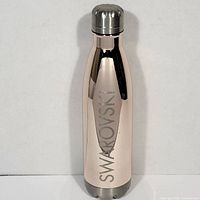 Full view of rose-gold stainless steel Swarovski water bottle