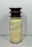 Full front view of vase showing glossy top and matte speckled body