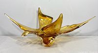 Front view of amber free-form Chalet art glass centerpiece