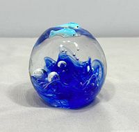 Front view showing dolphins and blue swirl