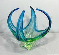 Front view showing blue-to-green curls and chartreuse base