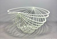 Overall view of white metal spiral fruit bowl