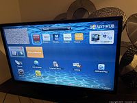 Front view of Samsung TV displaying Smart Hub menu