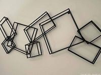 Front view showing full sculpture on wall