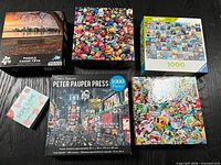 Group shot of five puzzle boxes and rope game