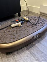 Top view of Eilison vibration plate with attached resistance bands
