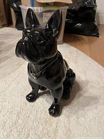 Front angle of glossy black ceramic French Bulldog figurine