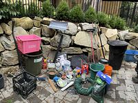 All items grouped on patio against rock wall