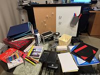 Overview of assorted office supplies on table
