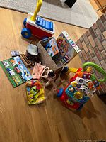 Group shot of entire toy lot on floor