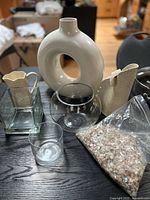 group shot of all vases and shell bag