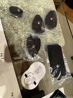 Sealed electrode pads and adhesive pad