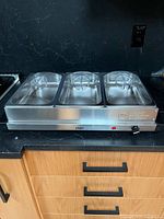 Front view of Oster three-compartment warming server