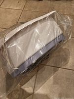 Foot bath lid or accessory sealed in plastic
