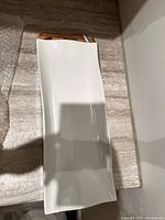 Top view of white porcelain plate on countertop