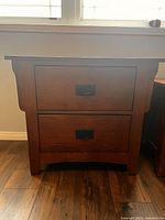 front view of nightstand showing two drawers and hardware