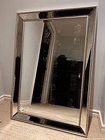Front view of rectangular silver framed mirror