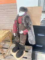 Full view of Santa figure side angle on wooden base