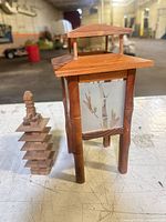 Lantern and pagoda side by side showing size and design