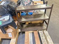 Front angled view of assembled 3-tier shelf on pallet