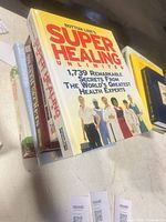 Stack of six health and wellness books with titles visible on top and partial spines