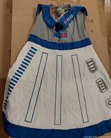 Full front view of R2-D2 halter sundress laid flat