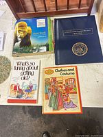 All four books laid out together