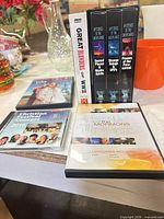 Group shot showing all DVDs, VHS set and CD