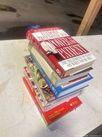Stack of seven health and wellness books showing spines and formats