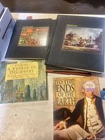 Stacked books showing Fighting Sail, unidentified Seafarers volume, A Voyage of Discovery, To the Ends of the Earth