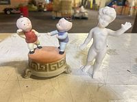 Front view of both porcelain pieces on tabletop