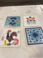 All four ceramic tiles laid out front view