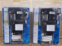 Front view showing two sealed Siemens QF230AP breakers