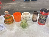 Front view of all six vessels on table