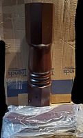 Mahogany pedestal column with four legs in plastic wrap