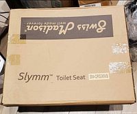 Box labeled Swiss Madison Slymm Toilet Seat SM-QRS06MB