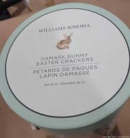 Lid of Williams Sonoma Damask Bunny Easter Crackers showing brand and set information
